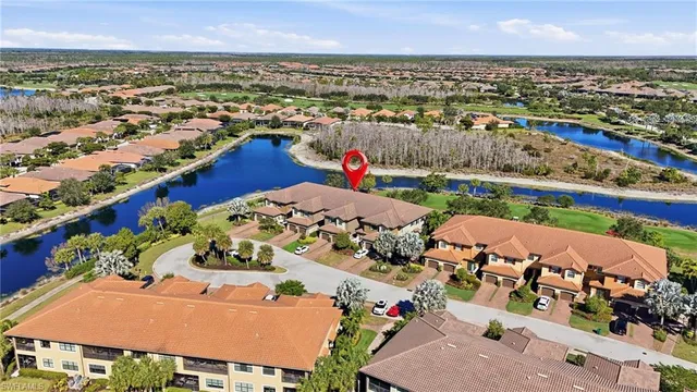 an aerial view of a house with a ocean view