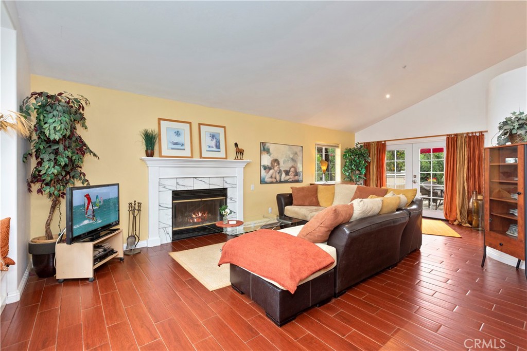 334 Rainbow Crest Road Fallbrook, CA 92028 - Photo 19 of 42 a living room with furniture a flat screen tv and a fireplace