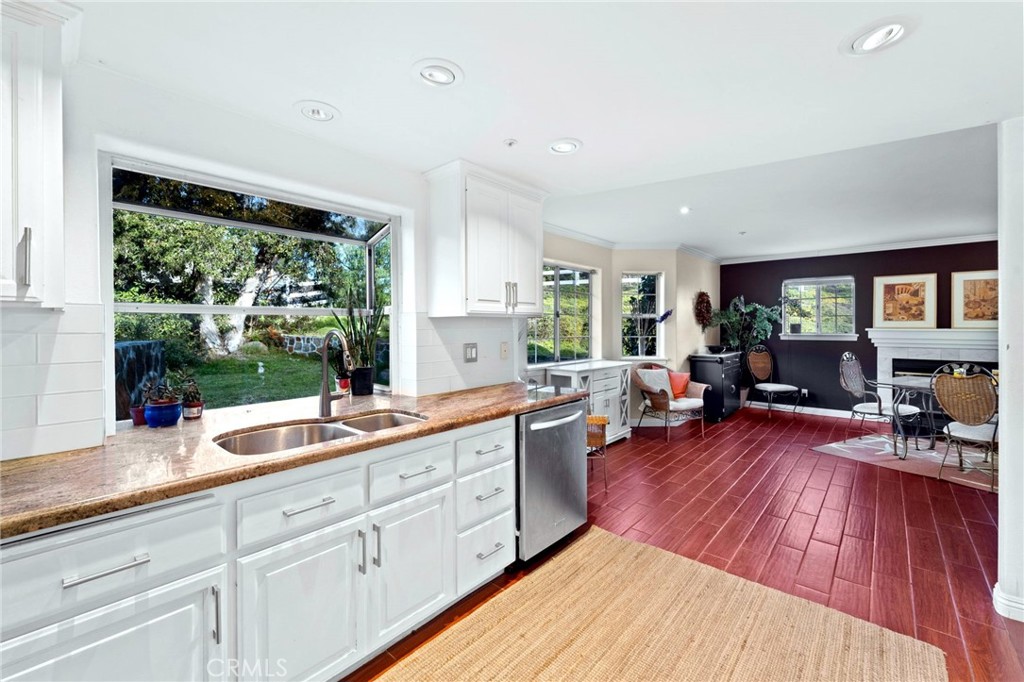334 Rainbow Crest Road Fallbrook, CA 92028 - Photo 23 of 42 a open kitchen with sink cabinets and wooden floor