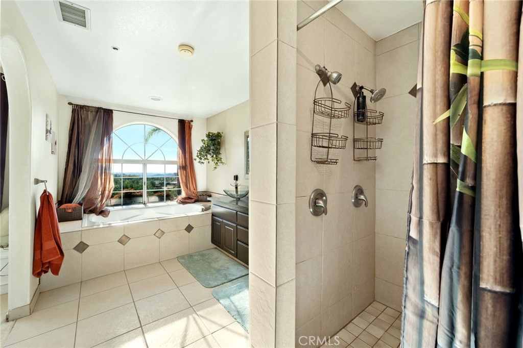 334 Rainbow Crest Road Fallbrook, CA 92028 - Photo 35 of 42 a bathroom with a granite countertop sink toilet and shower