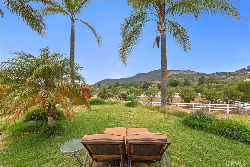 334 Rainbow Crest Road Fallbrook, CA 92028 - Photo 41 of 42 a backyard of a house with table and chairs