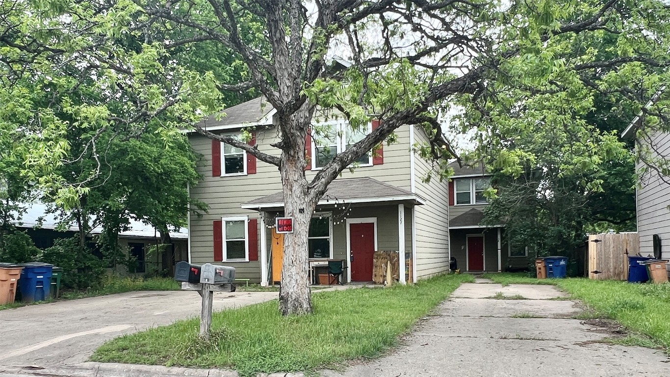 1127 Map Street, Unit A Austin, TX 78721 - Photo 1 of 1 a front view of a house with a yard and large tree
