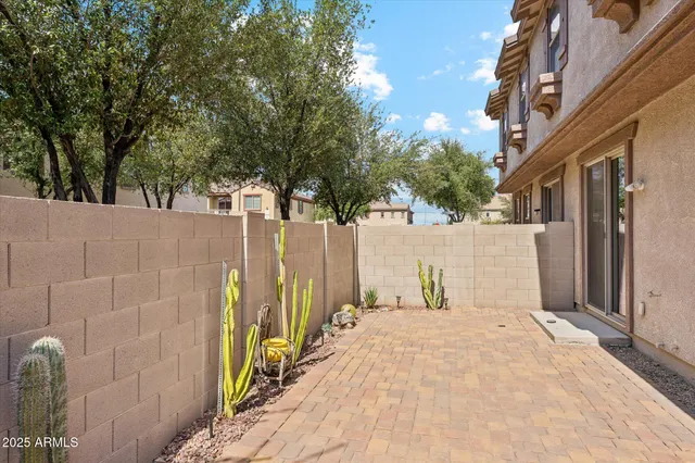 a view of a door with a wooden fence