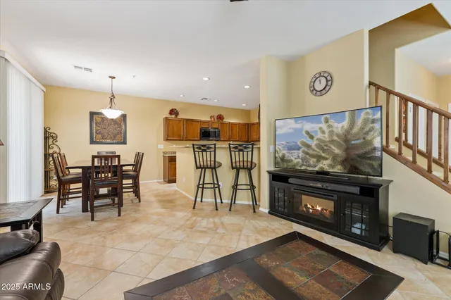 a view of a livingroom with furniture and a flat screen tv