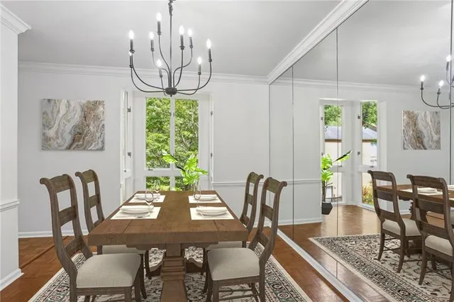 a view of a dining room with furniture window and wooden floor