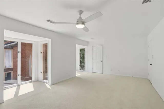 an empty room with fan