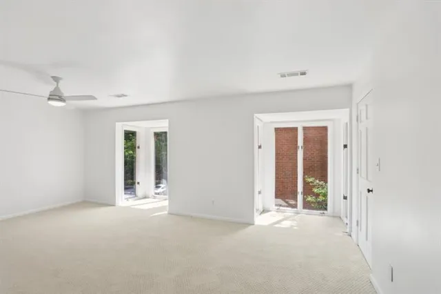 a bathroom with a sink double vanity granite tub shower and a mirror