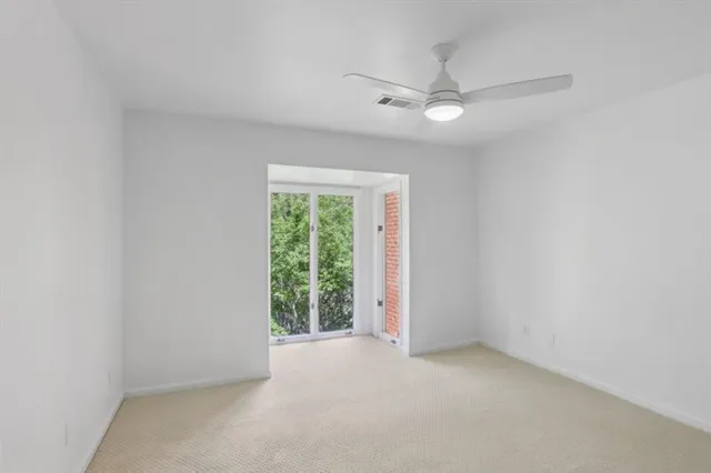 a bathroom with a granite countertop sink a toilet and a mirror