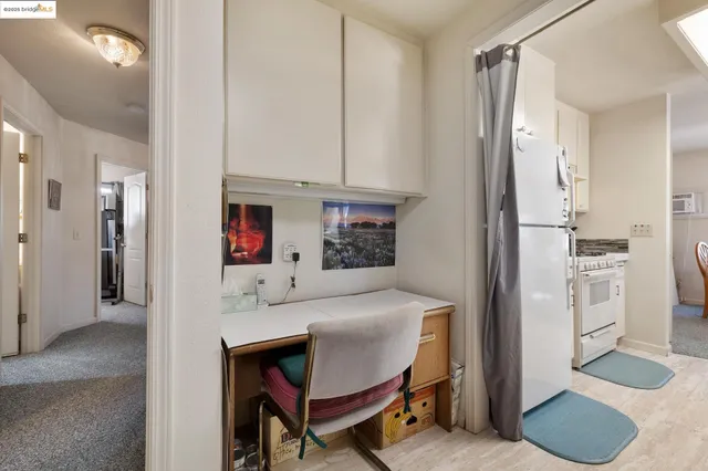 a dining room with furniture and a window