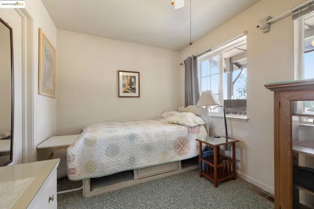 a bedroom with a bed and a table