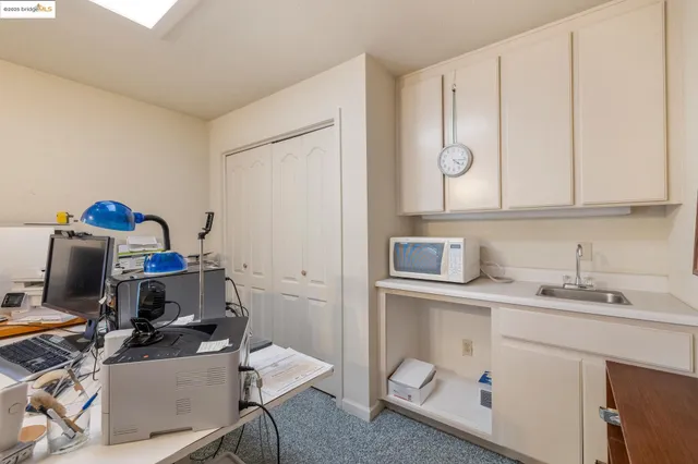 a view of a workspace with furniture