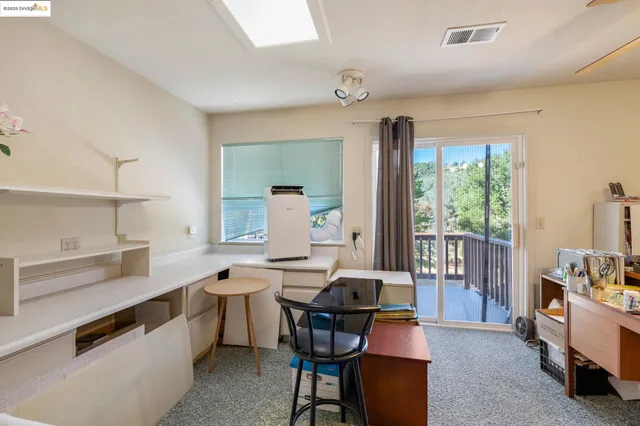 a view of a dining room with furniture window and outside view