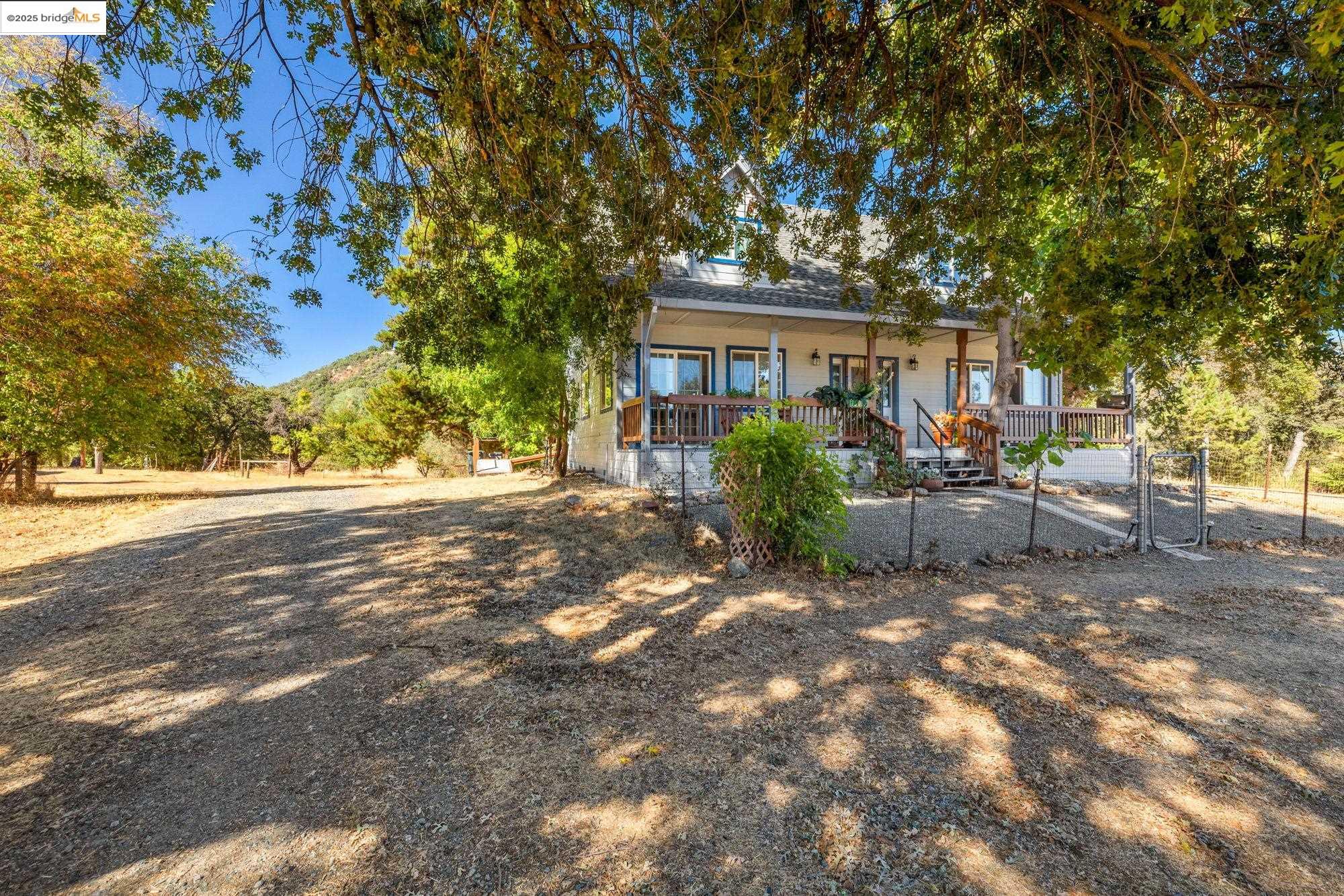 16641 Buckhorn Mountain Road Sonora, CA 95370 - Photo 31 of 44 View of front of house featuring covered porch and a gate