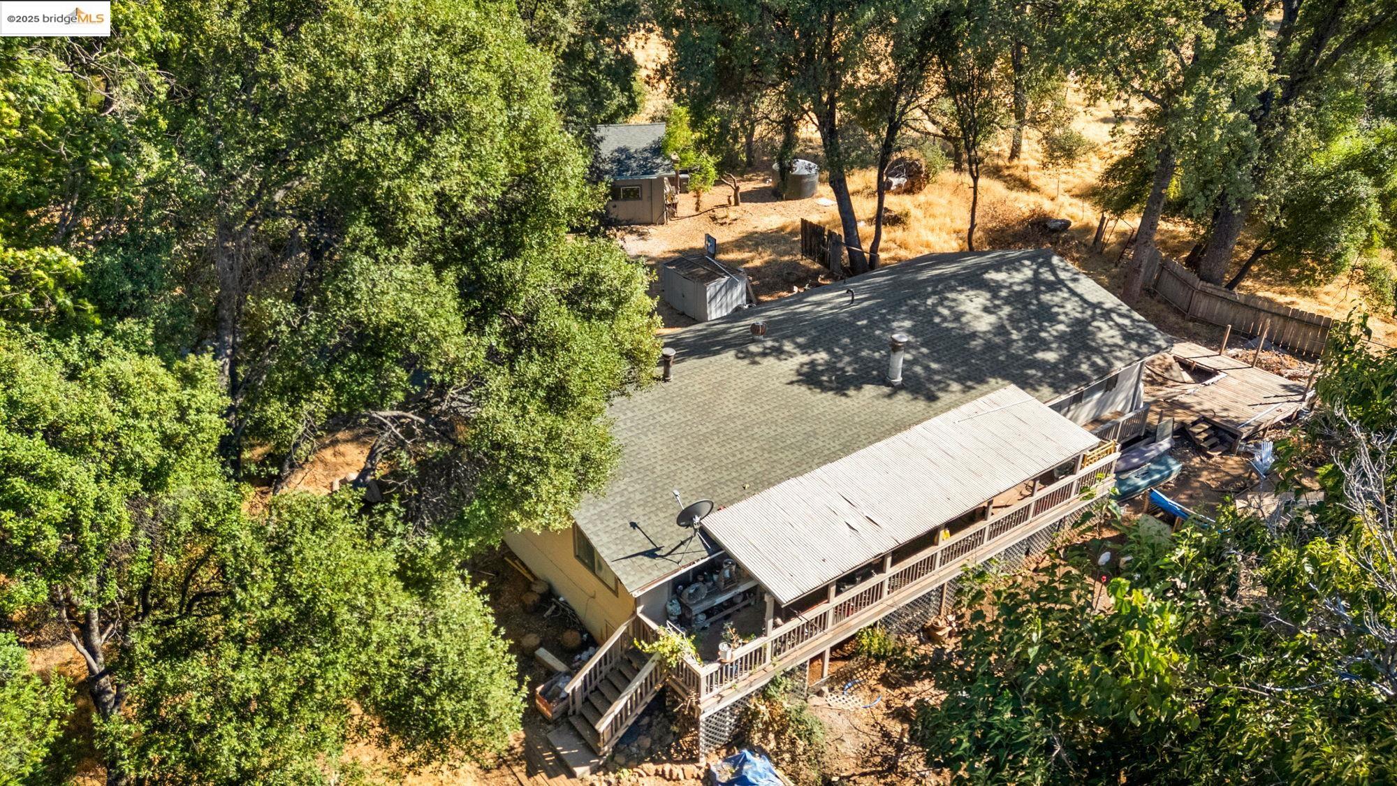 16641 Buckhorn Mountain Road Sonora, CA 95370 - Photo 36 of 44 View from above of property featuring a tree filled landscape