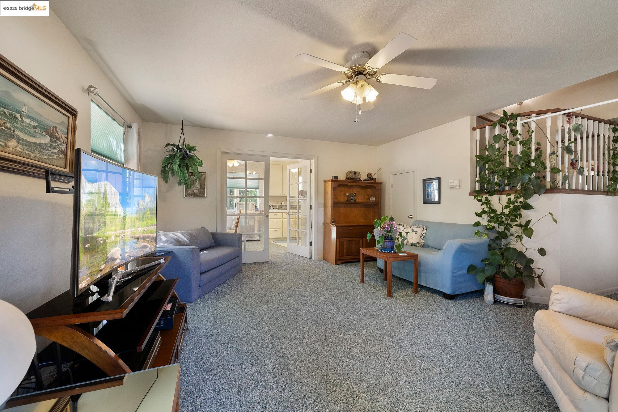 16641 Buckhorn Mountain Road Sonora, CA 95370 - Photo 8 of 44 Living area featuring carpet floors and ceiling fan