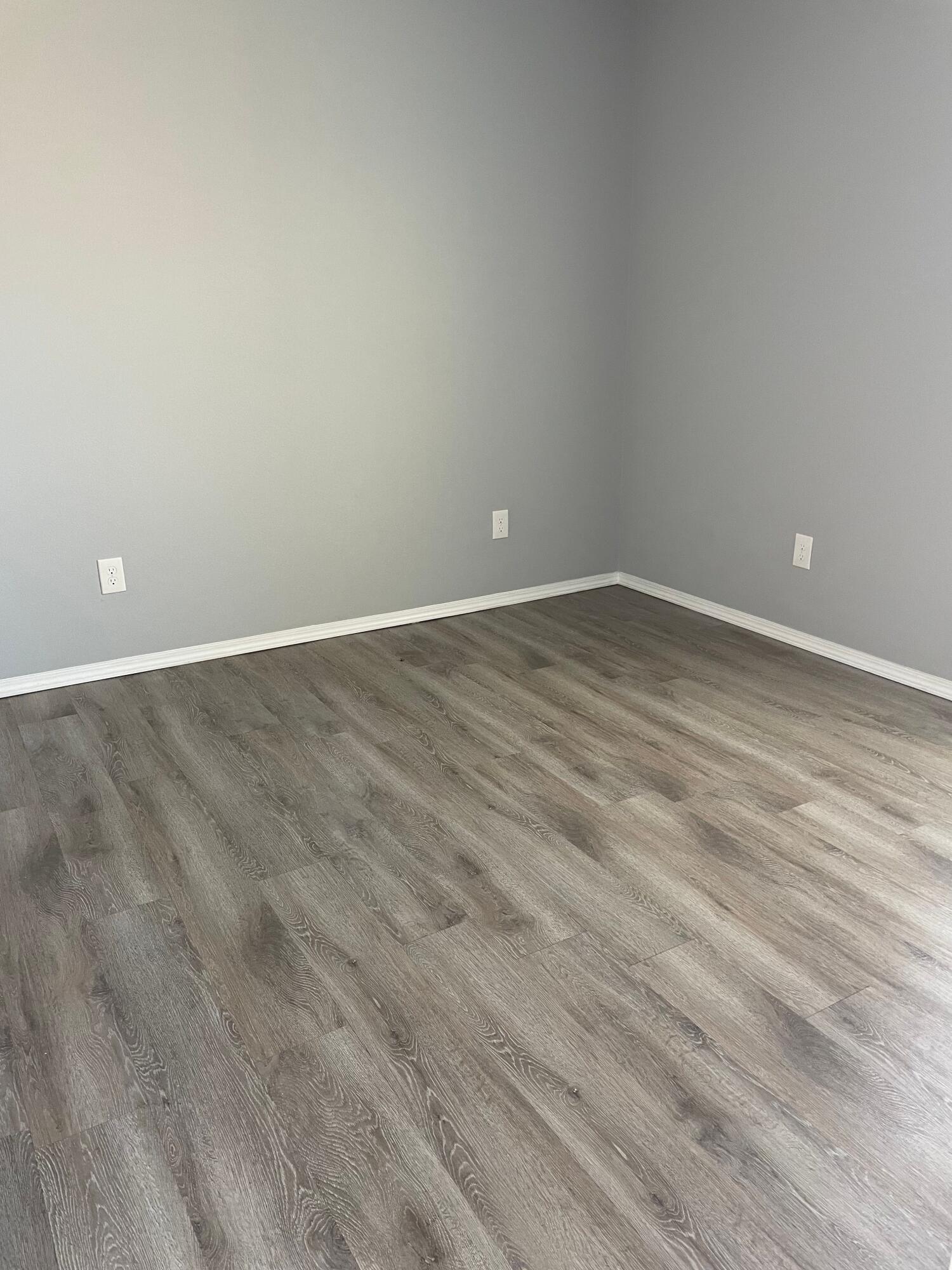 1301 North Colton Avenue, Unit A Lubbock, TX 79416 - Photo 5 of 9 an empty room with wooden floor