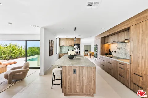 a kitchen with sink cabinets and outdoor view