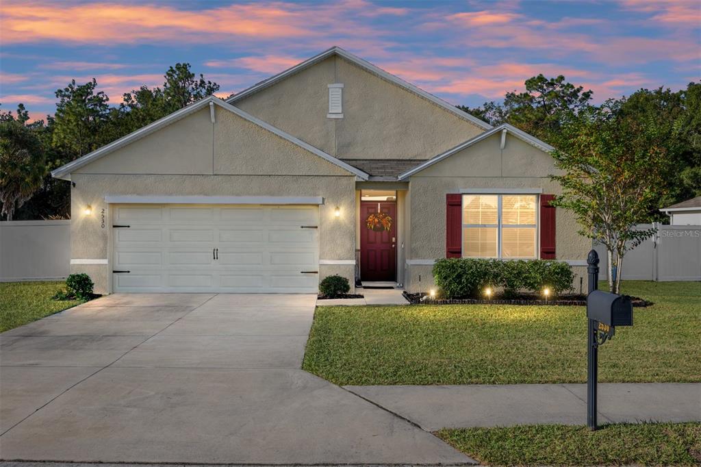 2530 Northeast 42nd Road Ocala, FL 34470 - Photo 1 of 61 a front view of a house with a yard