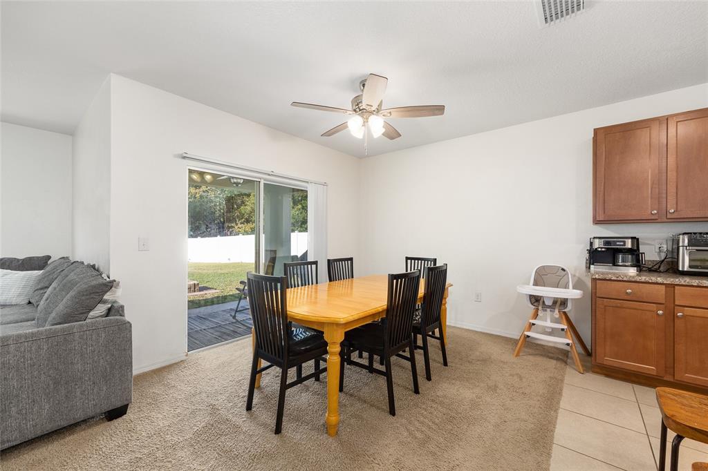 2530 Northeast 42nd Road Ocala, FL 34470 - Photo 15 of 61 a view of a dining room with furniture window and outside view
