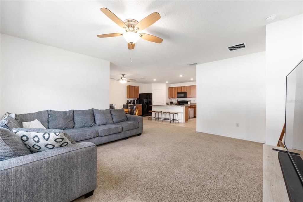2530 Northeast 42nd Road Ocala, FL 34470 - Photo 21 of 61 a living room with furniture and kitchen view