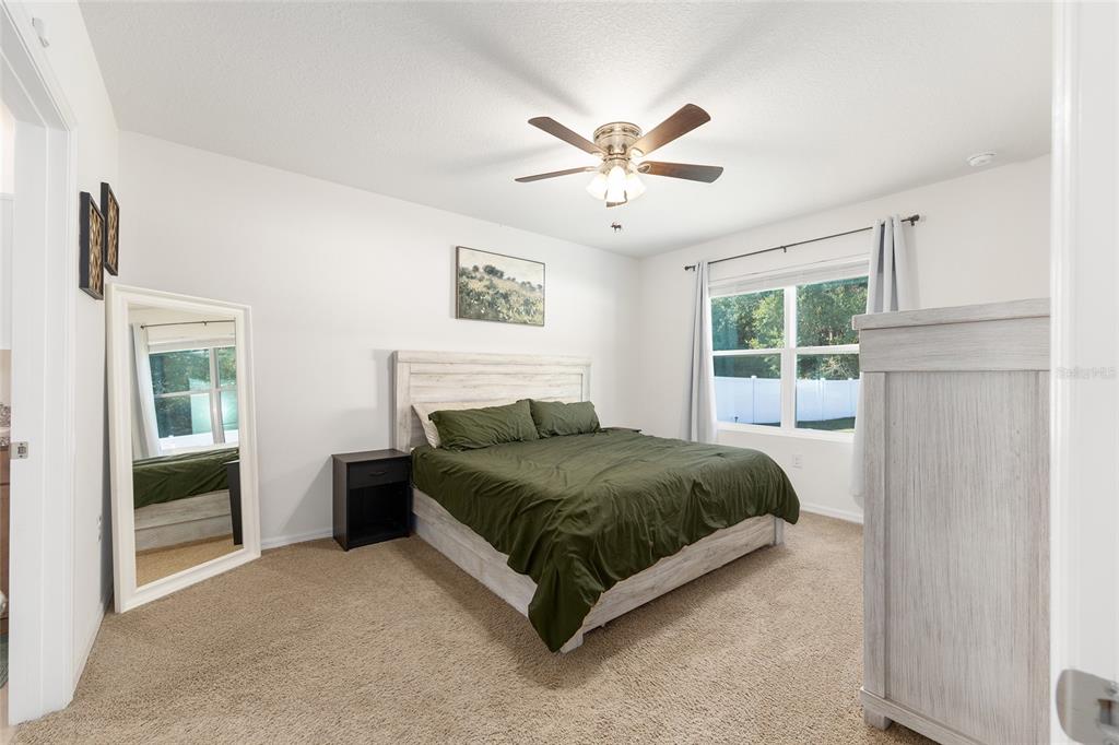 2530 Northeast 42nd Road Ocala, FL 34470 - Photo 22 of 61 a living room with a bed furniture and a window