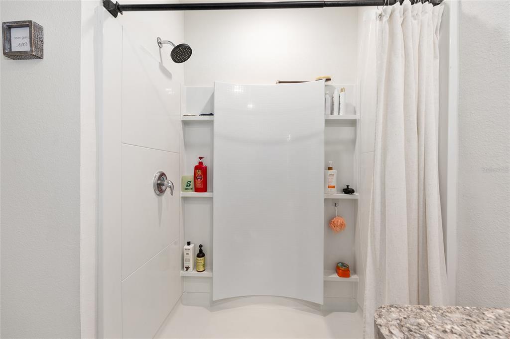 2530 Northeast 42nd Road Ocala, FL 34470 - Photo 27 of 61 a bathroom with a shower