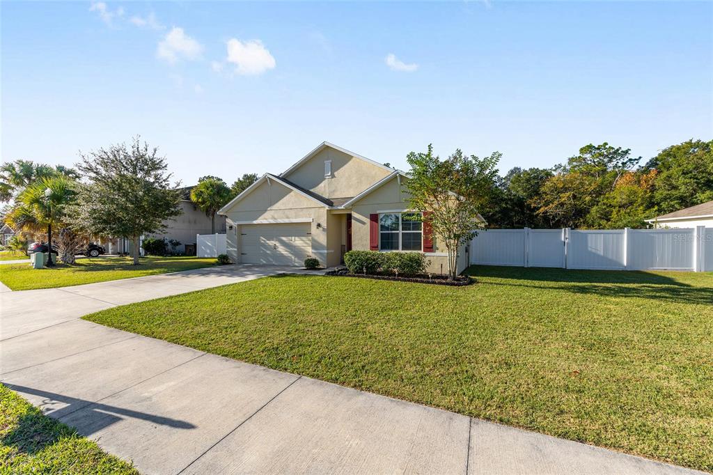 2530 Northeast 42nd Road Ocala, FL 34470 - Photo 3 of 61 a front view of a house with garden