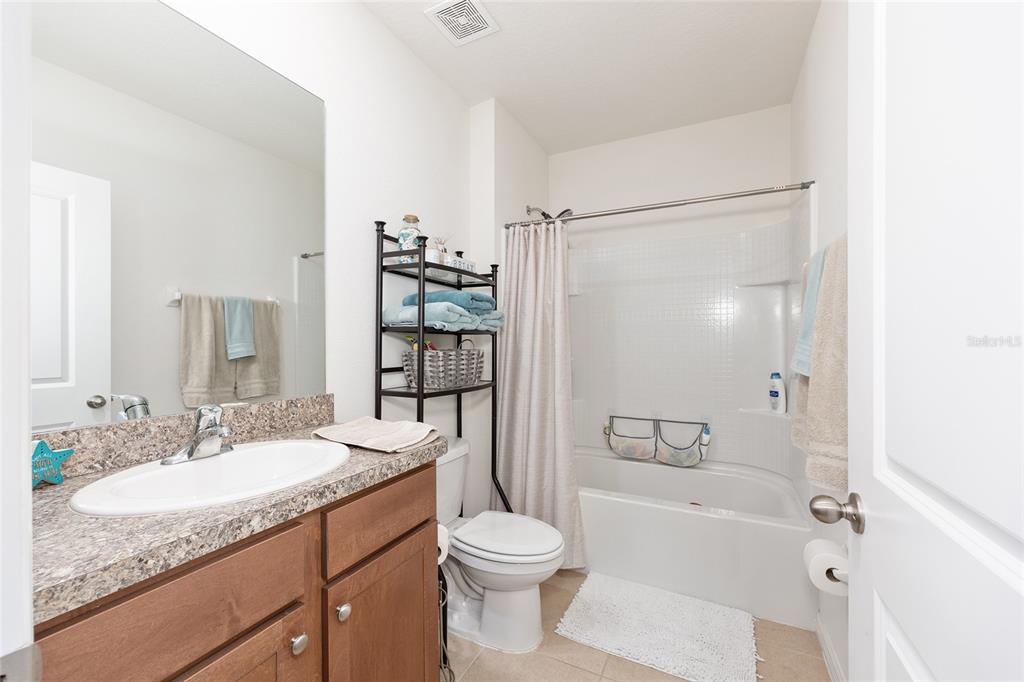2530 Northeast 42nd Road Ocala, FL 34470 - Photo 36 of 61 a bathroom with a granite countertop sink toilet and shower