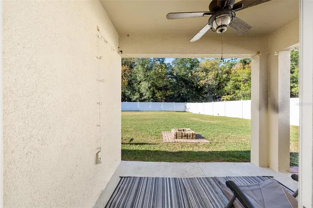 a aerial view of a house with a yard