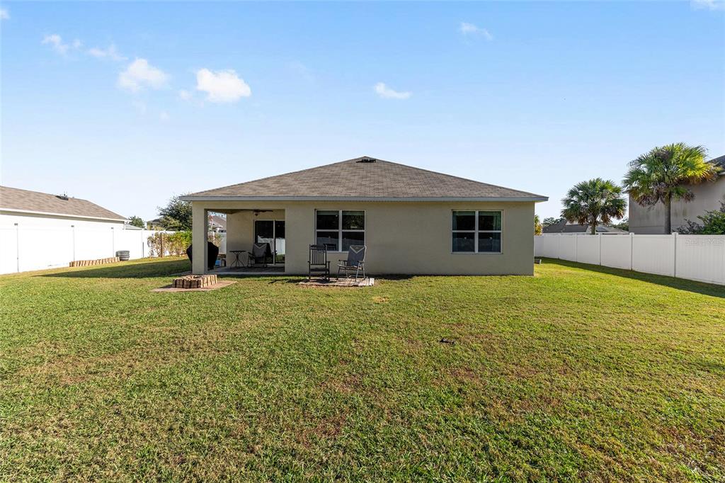 2530 Northeast 42nd Road Ocala, FL 34470 - Photo 42 of 61 a view of a house with a backyard