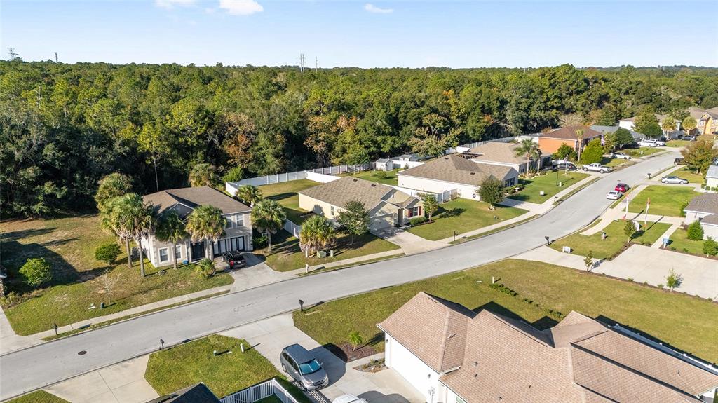 2530 Northeast 42nd Road Ocala, FL 34470 - Photo 49 of 61 an aerial view of residential houses with outdoor space