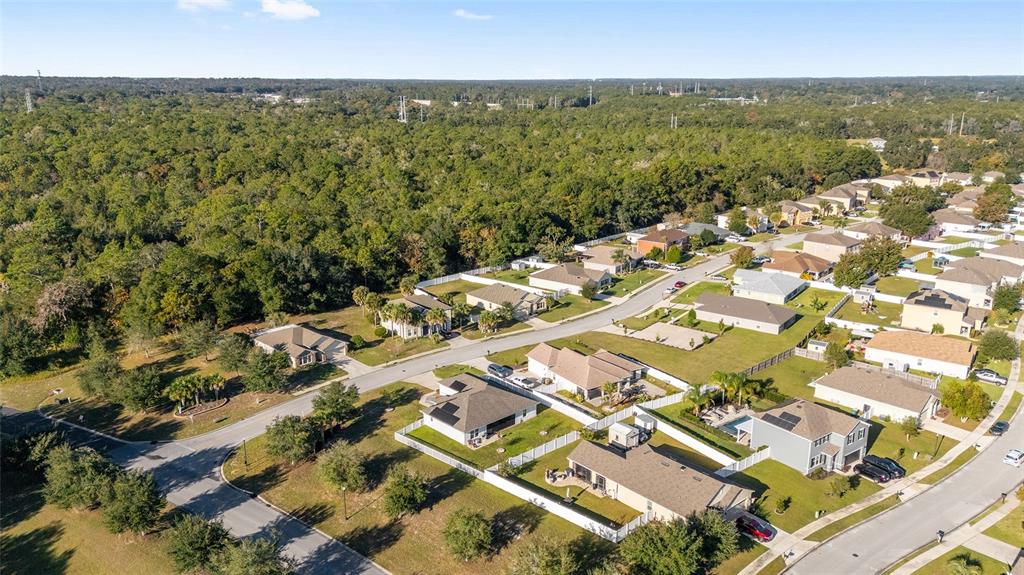 2530 Northeast 42nd Road Ocala, FL 34470 - Photo 50 of 61 an aerial view of residential building with parking space