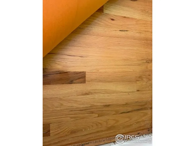 a bedroom with a bed and a mirror