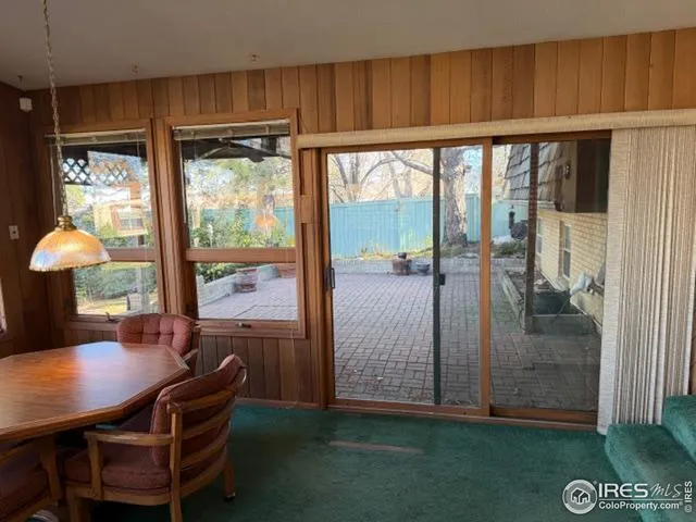 a view of a room with furniture and window