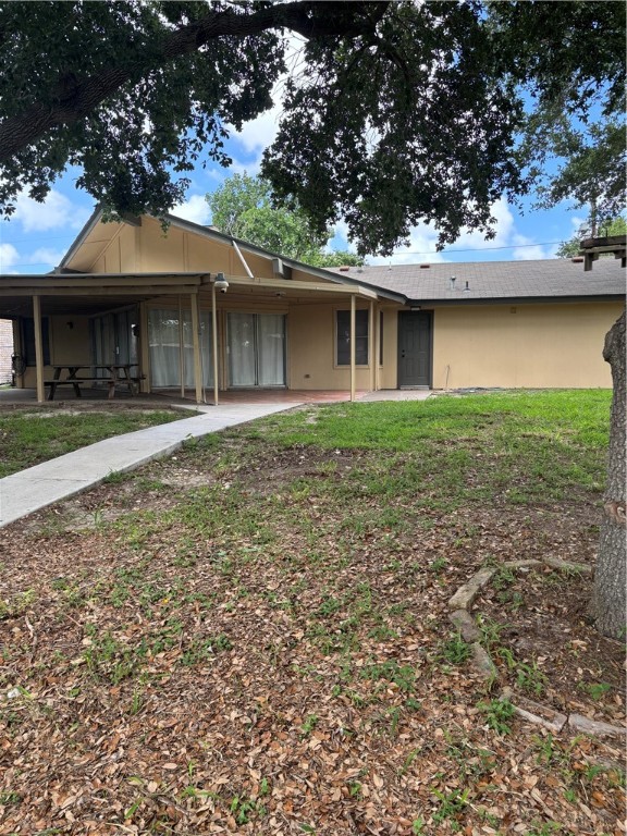 3208 Bimini Drive Corpus Christi, TX 78418 - Photo 14 of 14 a front view of a house with a garden