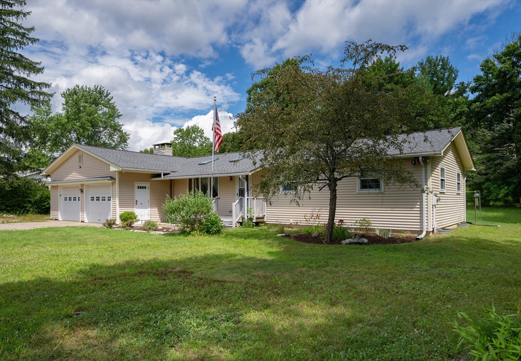 36 Gunn Road Southampton, MA 01073 - Photo 1 of 40 a front view of a house with a garden