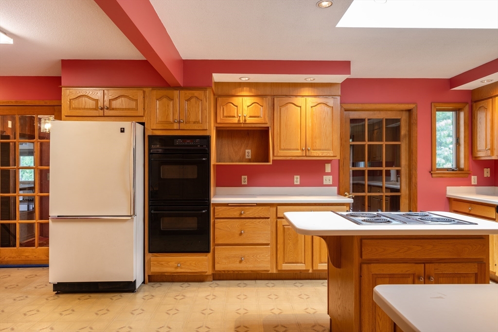 36 Gunn Road Southampton, MA 01073 - Photo 11 of 40 a kitchen with stainless steel appliances granite countertop a refrigerator a stove and a sink