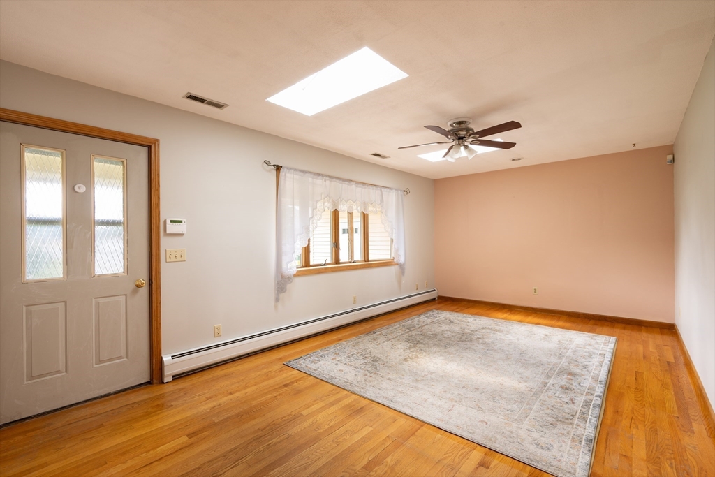 36 Gunn Road Southampton, MA 01073 - Photo 17 of 40 an empty room with wooden floor and windows