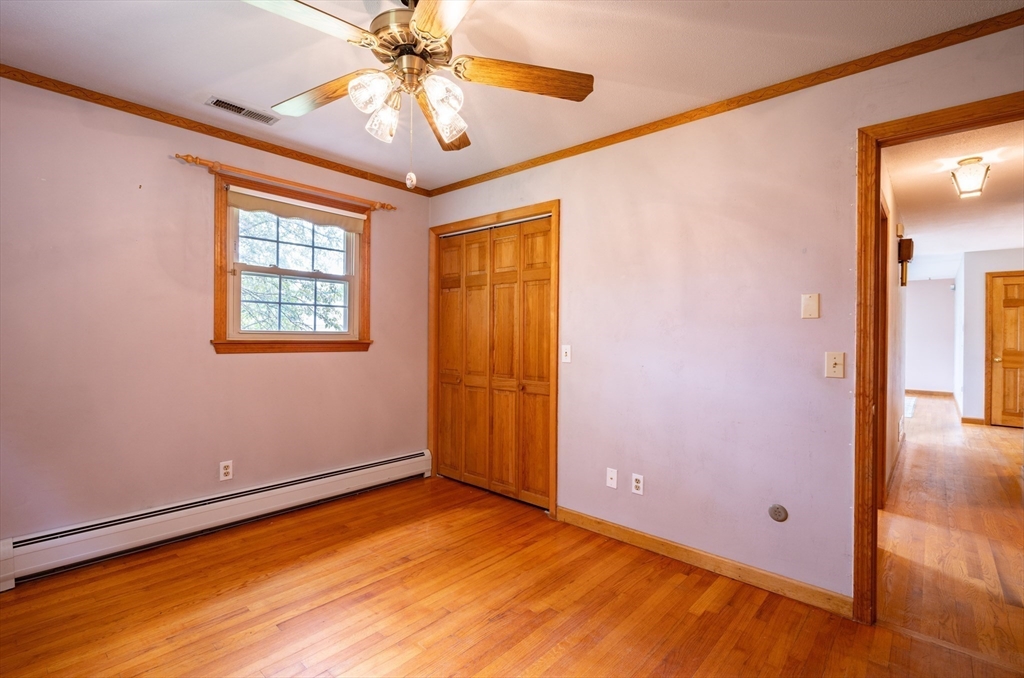 36 Gunn Road Southampton, MA 01073 - Photo 20 of 40 a view of an empty room with window and wooden floor