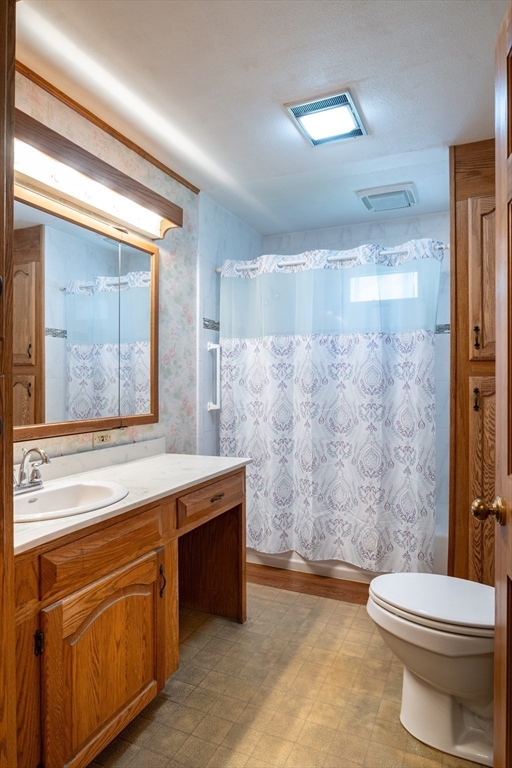 36 Gunn Road Southampton, MA 01073 - Photo 21 of 40 a bathroom with a sink a toilet and a bathtub