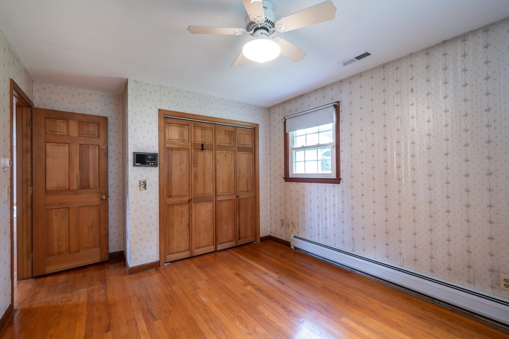 36 Gunn Road Southampton, MA 01073 - Photo 22 of 40 wooden floor in an empty room with a window
