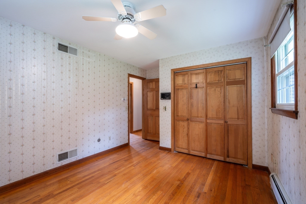 36 Gunn Road Southampton, MA 01073 - Photo 23 of 40 wooden floor in an empty room with a window