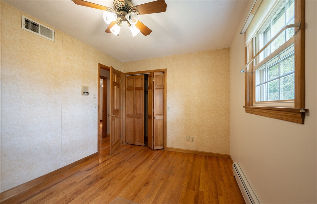 36 Gunn Road Southampton, MA 01073 - Photo 26 of 40 a view of empty room with wooden floor and fan
