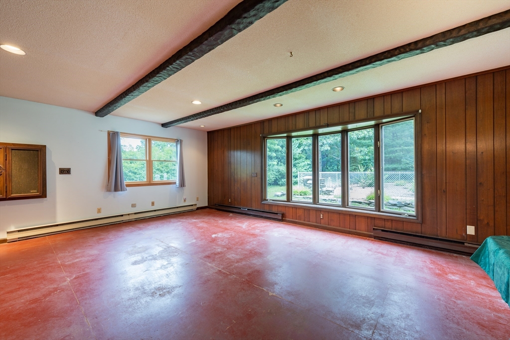 36 Gunn Road Southampton, MA 01073 - Photo 27 of 40 a view of an empty room with a window and wooden floor
