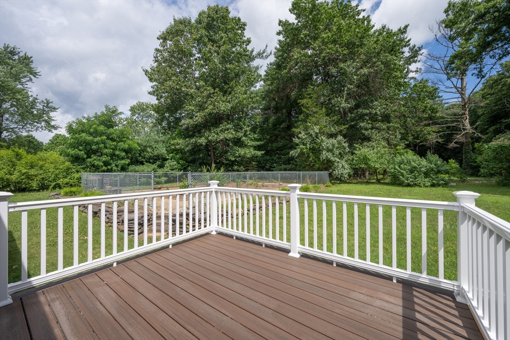 36 Gunn Road Southampton, MA 01073 - Photo 7 of 40 a balcony with wooden floor and fence