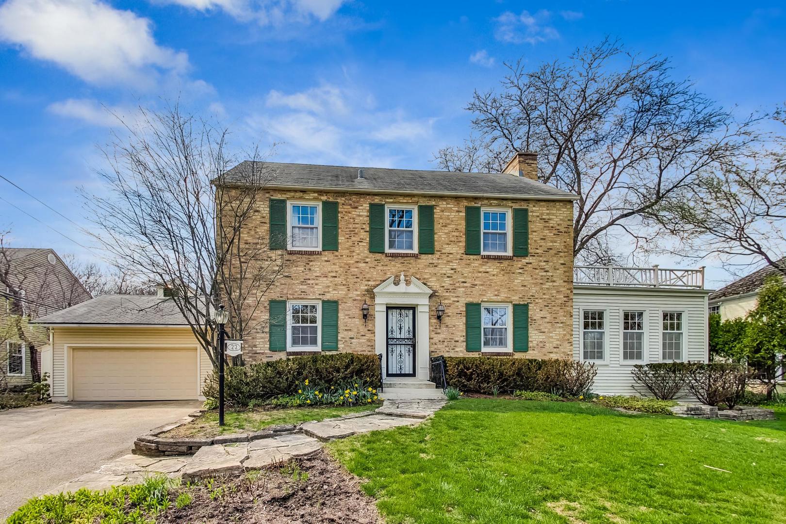 22 Timber Lane Northbrook, IL 60062 - Photo 1 of 41 a front view of a house with a yard and garage