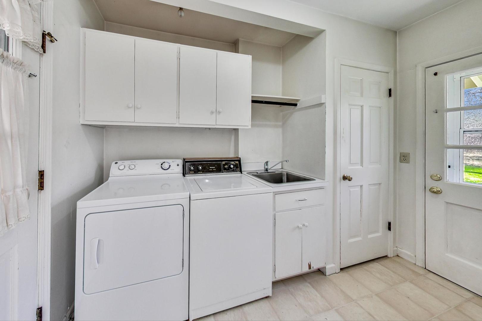 22 Timber Lane Northbrook, IL 60062 - Photo 16 of 41 a utility room with cabinets washer and dryer