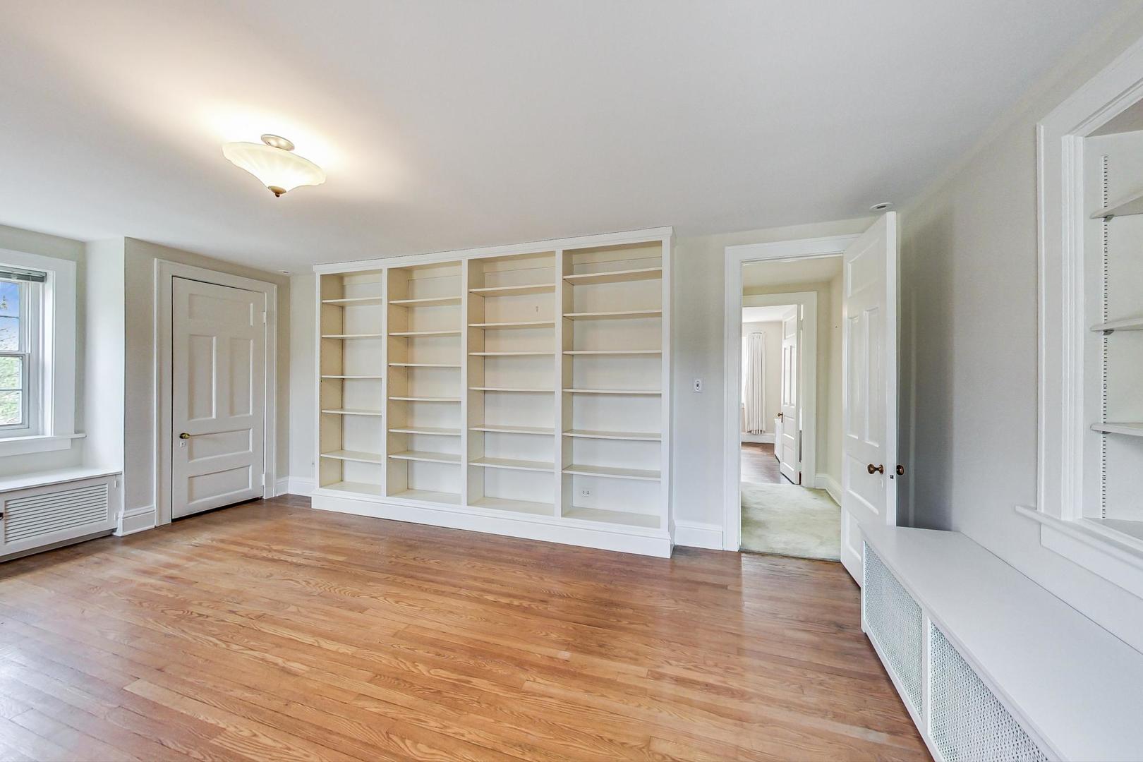 22 Timber Lane Northbrook, IL 60062 - Photo 25 of 41 wooden floor in an empty room with a window