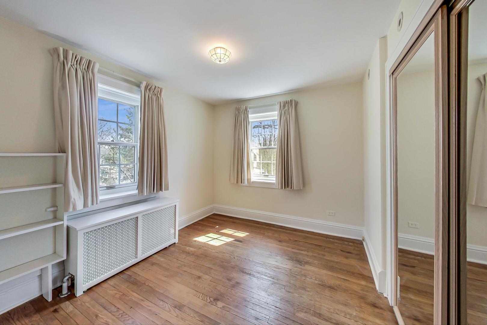 22 Timber Lane Northbrook, IL 60062 - Photo 26 of 41 a view of an empty room with wooden floor and a window