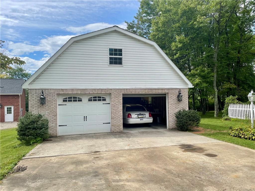 719 Zehner Road Indiana, PA 15701 - Photo 2 of 14 a view of a house with a yard and garage